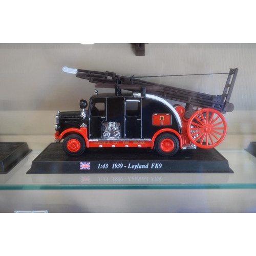 170A - Wall mounted display case containing twenty eight model fire engines from around the world and one f... 