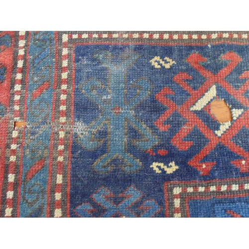 465 - Blue and red ground patterned rug - 2.34m x 1.26m