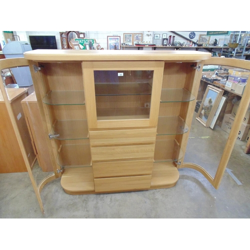 494 - Modern oak three door display cabinet with glazed rounded end doors - 57.5