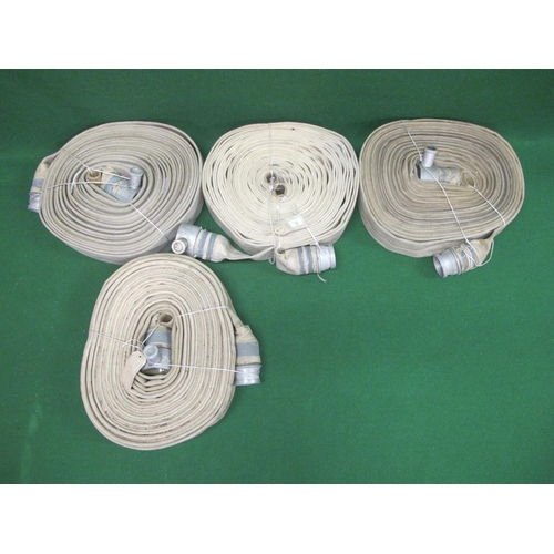 12 - Four fire hoses with couplings, one is stencilled W426927 1955.  Last tested/serviced in 1992