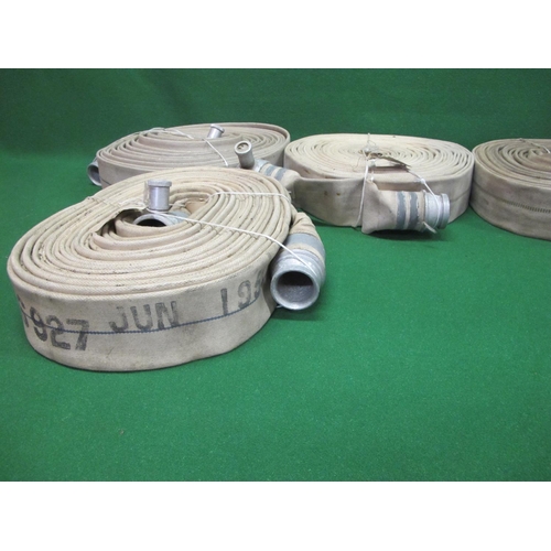 12 - Four fire hoses with couplings, one is stencilled W426927 1955.  Last tested/serviced in 1992