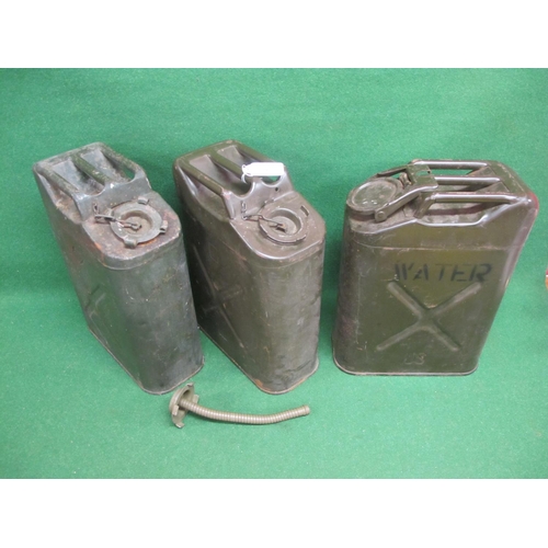 39 - Three US Jerry cans to comprise:  two fuel (1951 and 1980) one of which has a flexible nozzle and on... 