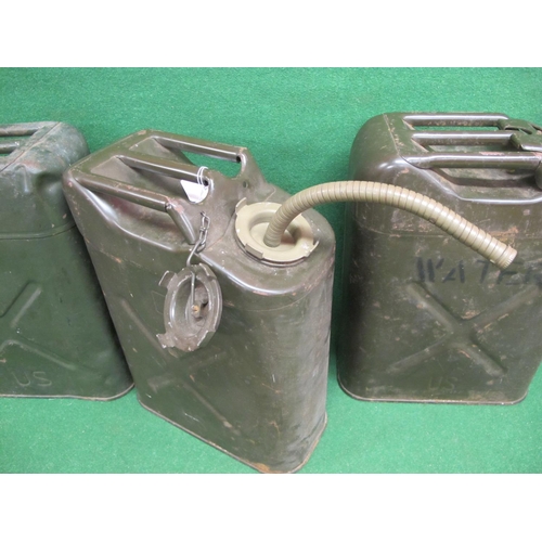 39 - Three US Jerry cans to comprise:  two fuel (1951 and 1980) one of which has a flexible nozzle and on... 