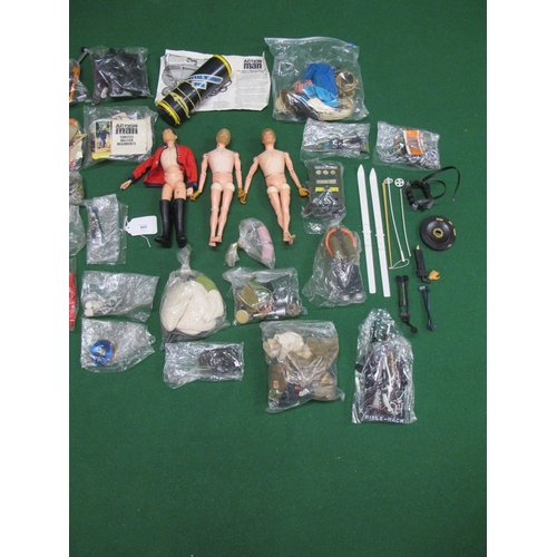 405 - Three different Action Men, Made in England by Palitoy with a large quantity of clothing, weapons, a... 