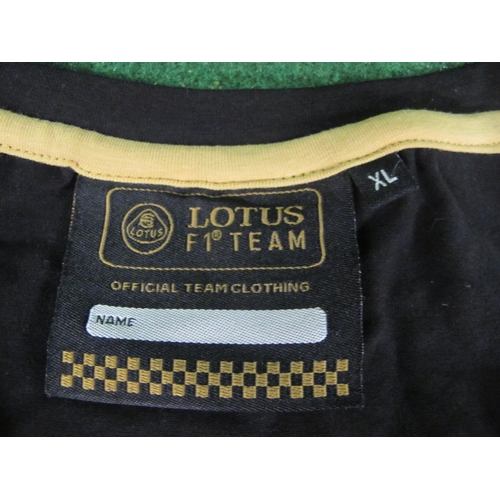 52 - Five 2013 F1 Grand Prix season Lotus Official Team V neck shirts.  Sizes:  three M and two XL