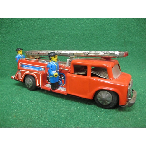 544 - Two painted rough cast metal horse drawn fire appliances together with a tin plate friction drive fi... 