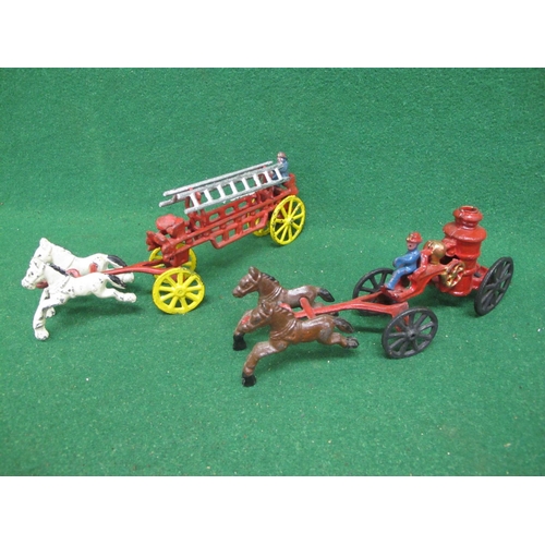 544 - Two painted rough cast metal horse drawn fire appliances together with a tin plate friction drive fi... 