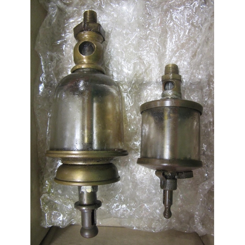 66 - Two brass and glass oil reservoirs, one stamped Michigan Lubricator Co. Detroit - total lengths 5