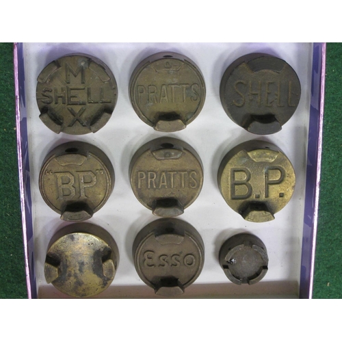 85 - Nine various castellated brass fuel can threaded caps to comprise: two versions each of Pratts and B... 