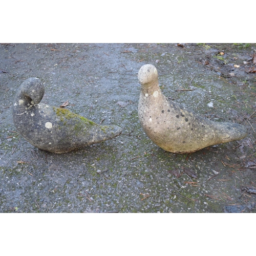 7 - Pair of weathered reconstituted garden ornaments of doves - 10.5