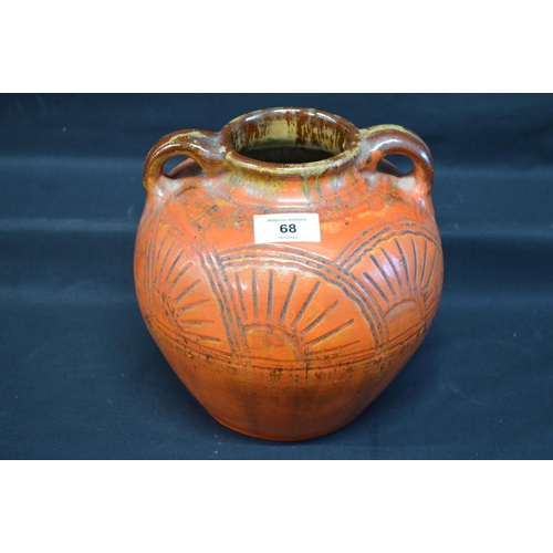 68 - Art pottery bulbous two handled vase in orange glaze with sun burst style decoration - 7.75