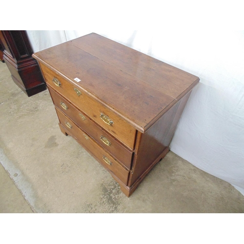 536 - 19th century oak chest of three long drawers, standing on bracket feet - 37.75