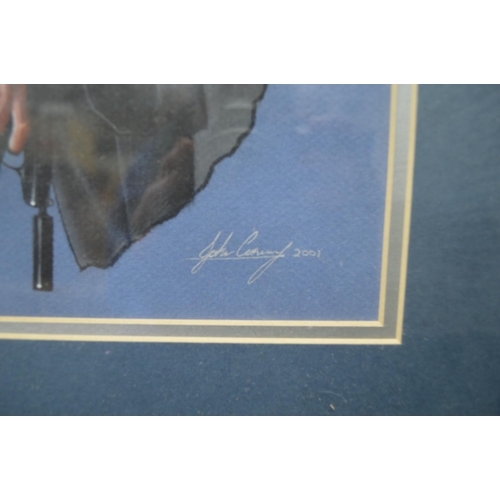 103 - James Bond/Pierce Brosnan picture by John Conway 2001, in glazed gilt frame - 14.75