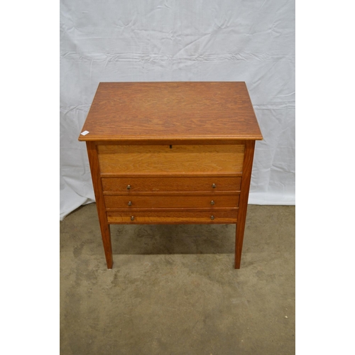 11 - Oak free standing cabinet containing a quantity of silver plated and stainless steel cutlery