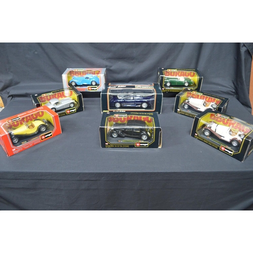 118 - Seven boxed Burago 1:24 scale model cars together with a Maisto 1:18 scale model Jaguar XJ220