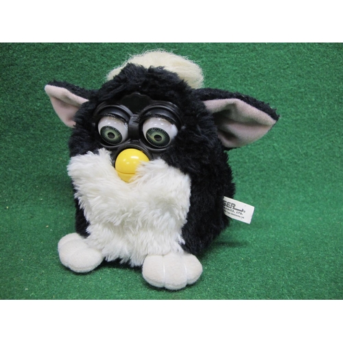 24 - 1998 Skunk Furby made by Tiger Electronics with instruction manual and Furbish-English Dictionary, c... 