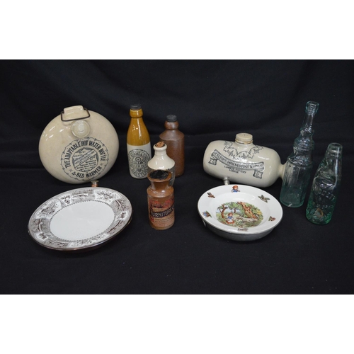 39 - Two stoneware hot water bottles together with two warming plates and six various bottles