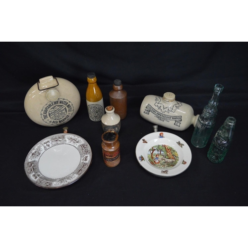 39 - Two stoneware hot water bottles together with two warming plates and six various bottles