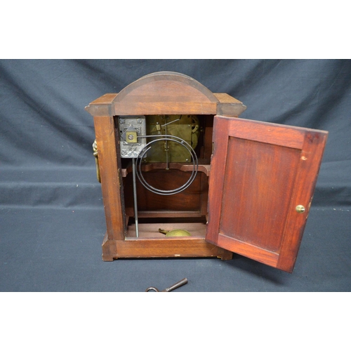 66 - Inlaid mahogany mantel clock having white enamel dial, black numerals and black hands - 12.25