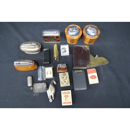 76 - Quantity of table and pocket lighters to include: silver plated Dunhill pocket lighter and a brass Z... 