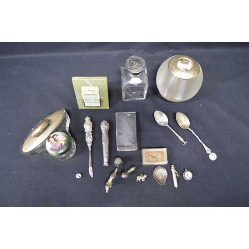 92 - Quantity of silver and white metal items to include: match striker, matchbox holder, compass, desk c... 