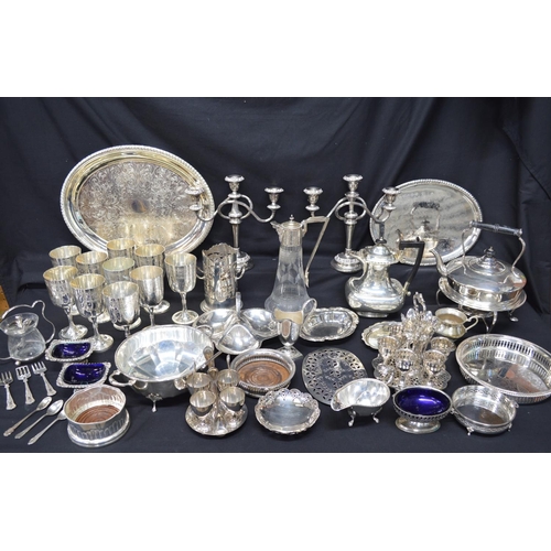 182 - Collection of silver plate to include: Harrods spirit kettle, set of ten goblets and bottle coaster ... 
