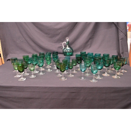 193 - Collection of forty eight Georgian Green wine glasses having green bowls on clear stems and circular... 