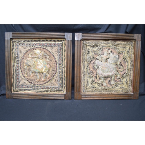 194 - Two Burmese tapestry wall hangings of figures on elephants, in unglazed wooden frames - 19.75