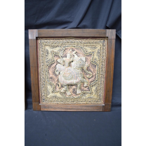 194 - Two Burmese tapestry wall hangings of figures on elephants, in unglazed wooden frames - 19.75