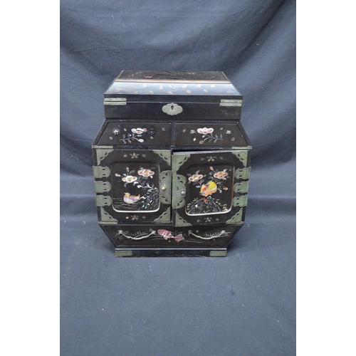 195 - 20th century Japanese lacquered table top cabinet with lift top over two doors opening to reveal dra... 