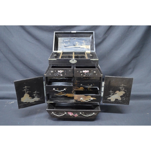 195 - 20th century Japanese lacquered table top cabinet with lift top over two doors opening to reveal dra... 