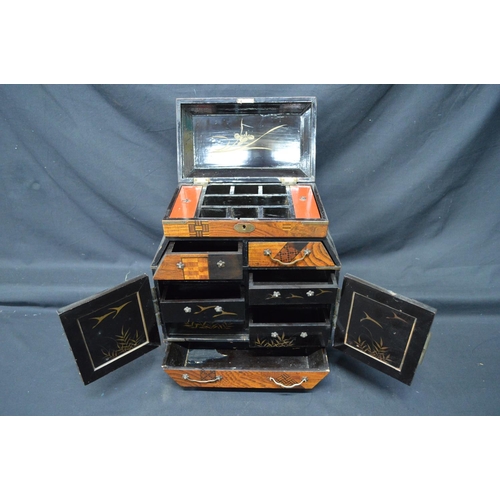 197 - 20th century lacquered and marquetry Japanese table top cabinet having lift top over two drawers and... 