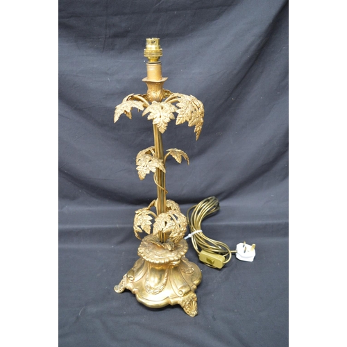 202 - Gilt metal foliate decorated table lamp on three scrolled feet - 22