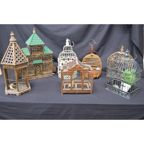 206 - Group of seven small ornamental birdcages of various shaped and styles