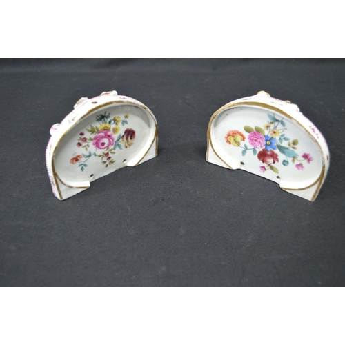 215 - Pair of Meissen wall brackets having panels of figures, flowers and game surmounted by pink and gilt... 