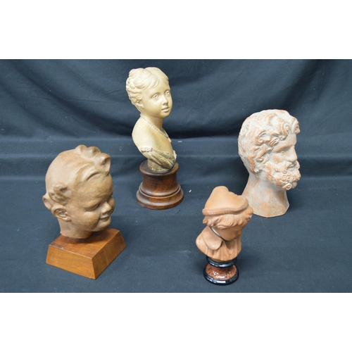 217 - Group of four earthenware busts to include: 1949 Betty Hendrick bust of a toddler - tallest 11.6