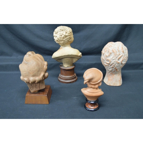 217 - Group of four earthenware busts to include: 1949 Betty Hendrick bust of a toddler - tallest 11.6
