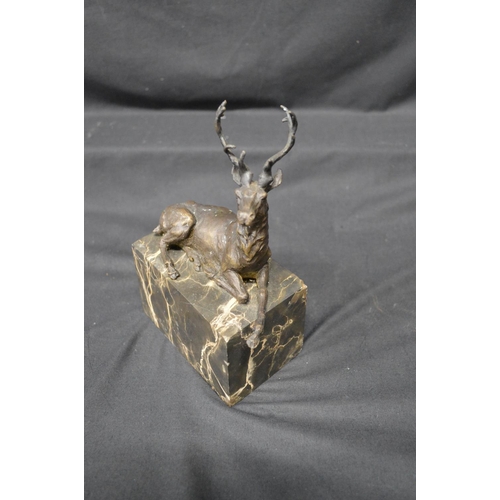 220 - After L Carvin, bronze figure of a recumbent stag on veined marble base, incised name to verso - 7.2... 
