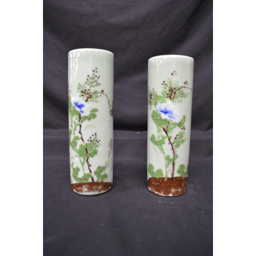 230 - Two Celadon green glazed cylindrical vases having foliate decoration - 9.75