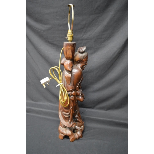 239 - Oriental carved wooden figural lamp - 26