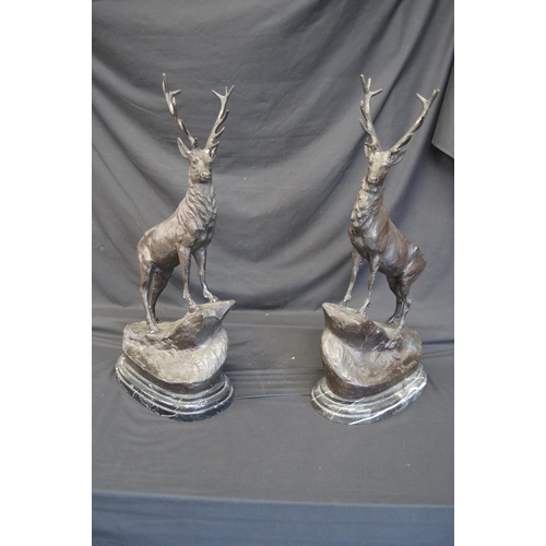242 - Pair of late 20th century bronze figures of Stags after J Moigniez (signed), standing on raised marb... 