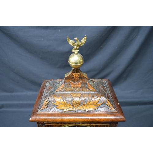 256 - Oak carved mantel clock by Bennett Bros. having black chapter ring with gilt Roman Numerals and gilt... 