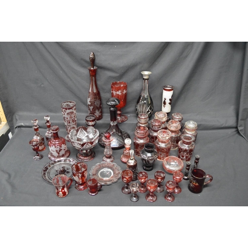 258 - Collection of Ruby Red and clear glassware to include: pickle jars, decanters, scent bottles and dri... 