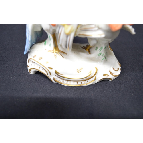 266 - Pair of possibly Chelsea figural groups of Peacocks on shaped bases with gilt highlights, each beari... 