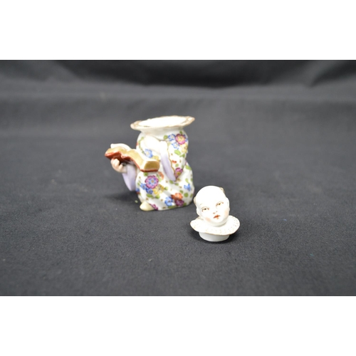 267 - Sampson (?) inkwell in the form of a choir boy in floral robe, impressed S on base - 3.25