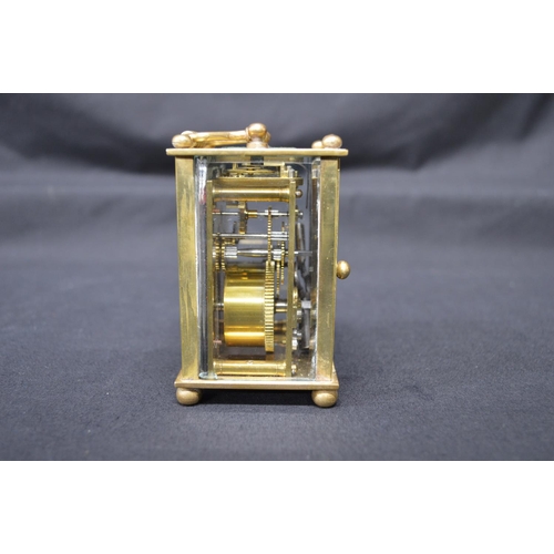 285 - French brass and glass cased carriage clock with top carrying handle and later painted dial (in af c... 