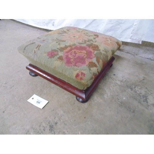 496 - Victorian mahogany framed foot stool with floral woolwork top, standing on bun feet - 12.5