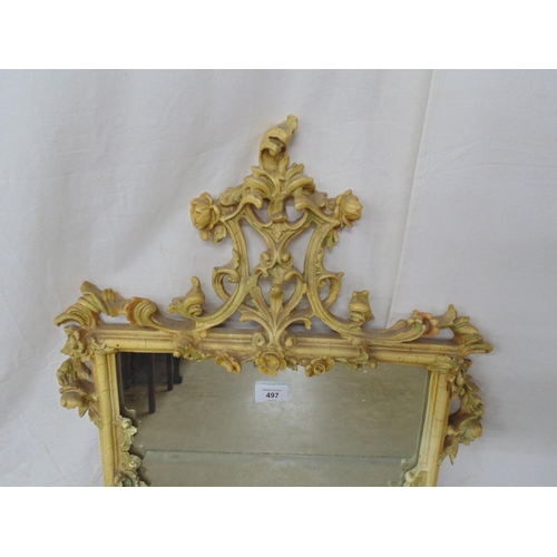 497 - Ornate painted resin wall mirror having a floral and foliate frame - 40.5