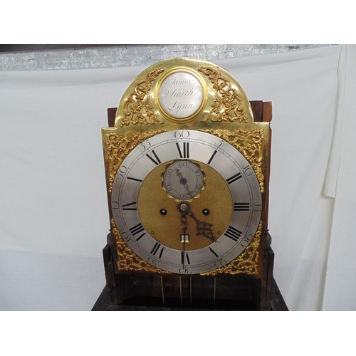 505 - James Smith Lynn, mahogany longcase clock having brass silvered arched dial with Roman Numerals and ... 