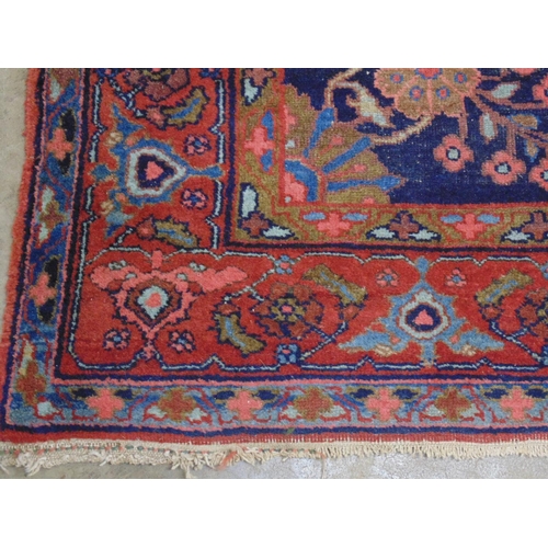 439 - Blue ground red, olive green, pink and pale blue patterned rug (end tassels af) - 1.24m x 2.6m